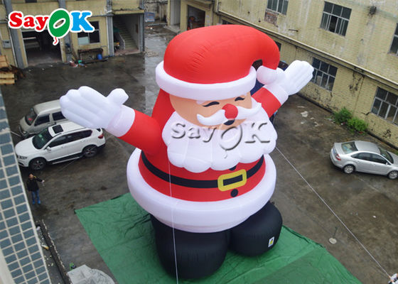 8 متر في الهواء الطلق عيد الميلاد نفخ سانتا كلوز يرتدي قبعة حمراء